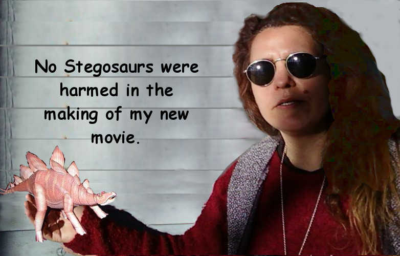 Trista holding Stegosaurus paper model in her hand