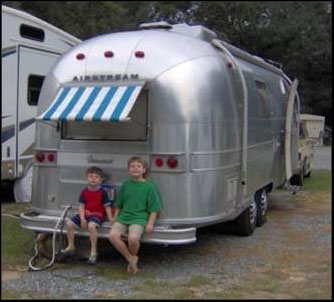 Airstream sitting under the awning