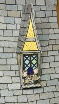 cute mouse in story book house window